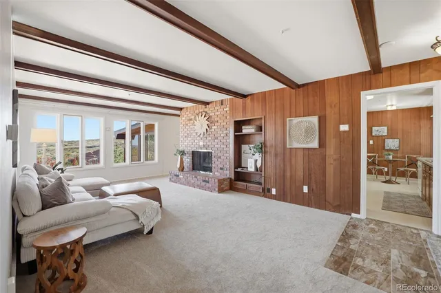 a spacious bedroom with a large bed and a large window