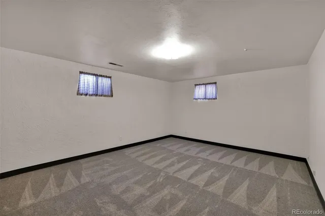 an empty room with closet area