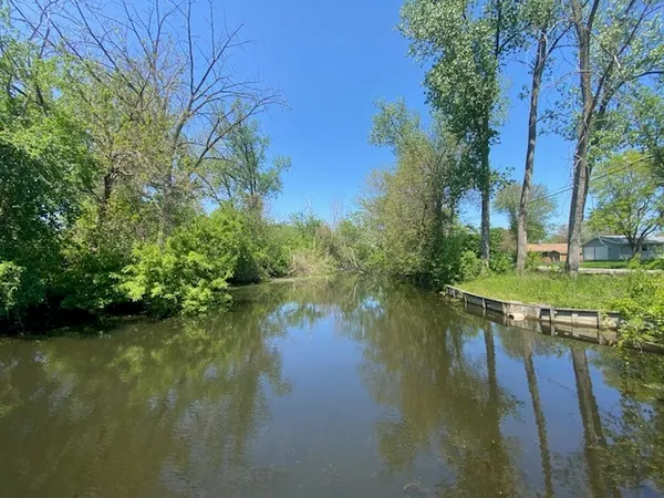 a view of lake with green space