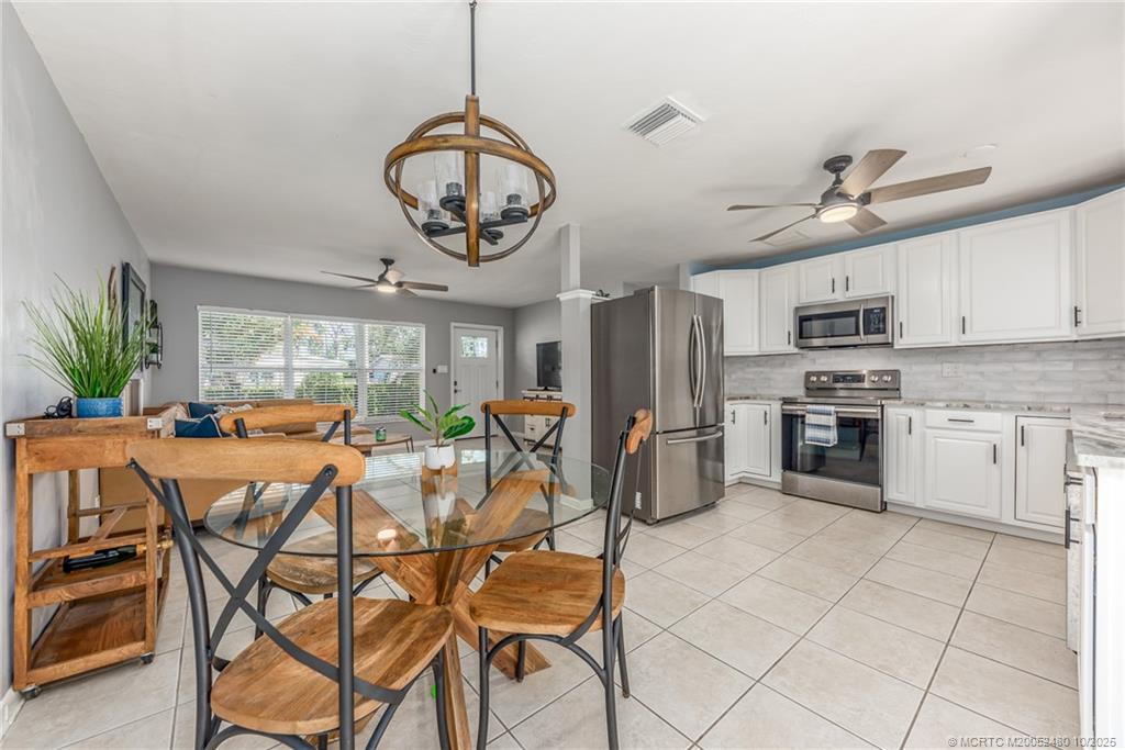 a view of a kitchen with furniture and a window