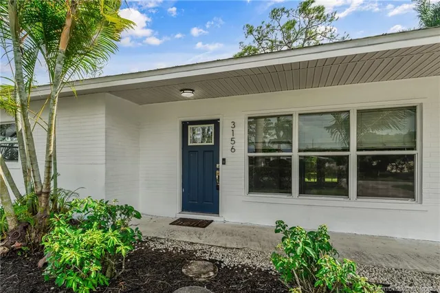 a bedroom with a bed and a television