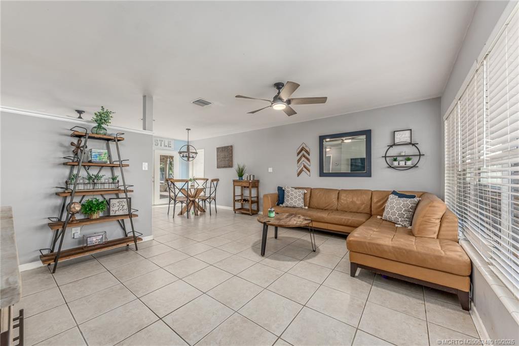 3156 Southeast Mimosa Street Stuart, FL 34997 - Photo 15 of 38 a living room with furniture and wooden floor