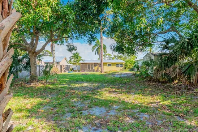 a backyard of a house with lots of green space