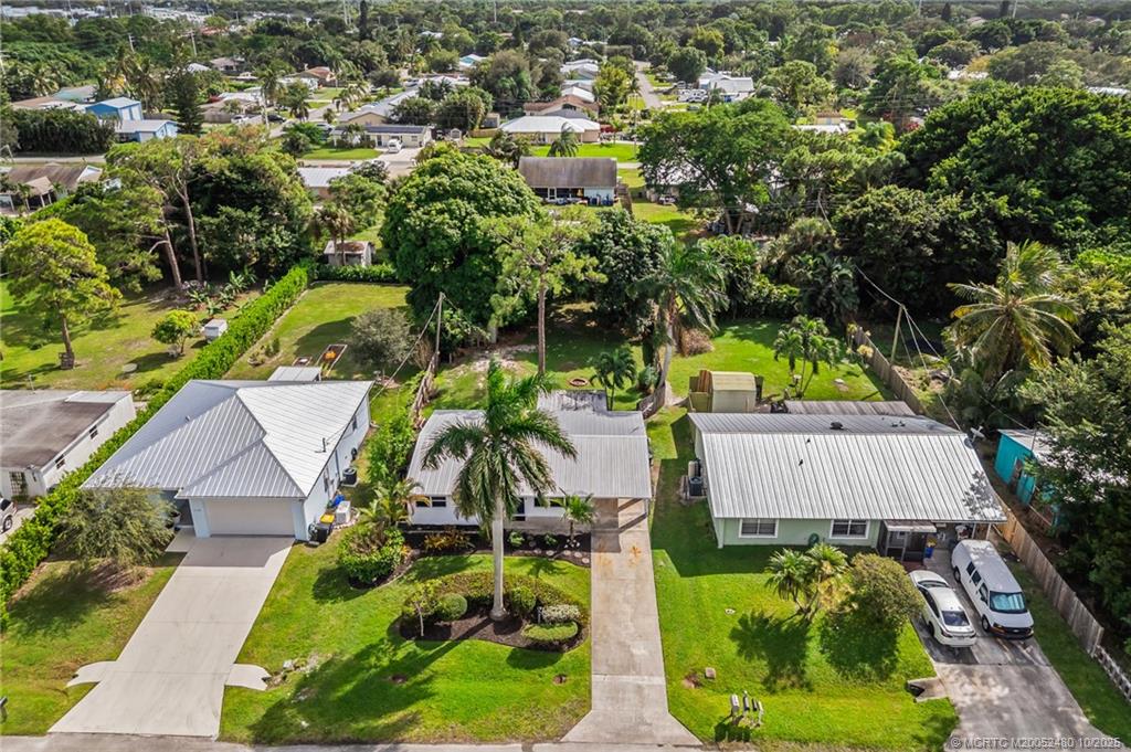 3156 Southeast Mimosa Street Stuart, FL 34997 - Photo 5 of 38 an aerial view of a house with yard swimming pool and outdoor seating