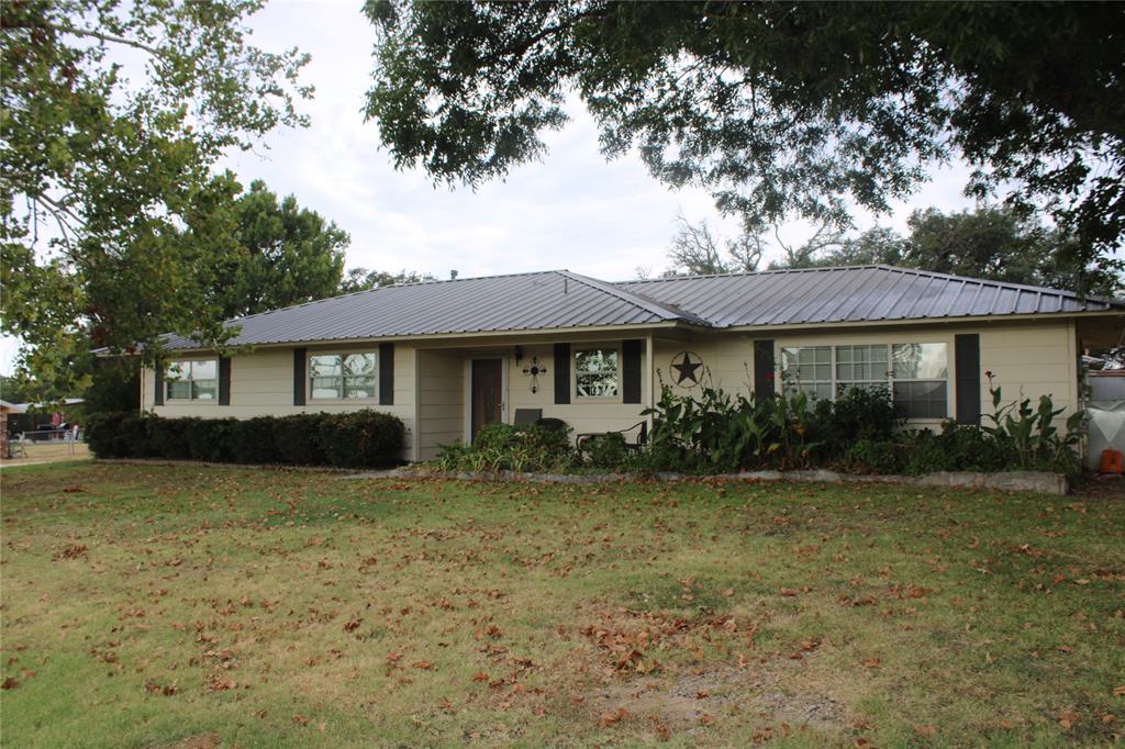 18801 Ford Street May, TX 76857 - Photo 1 of 1 Ranch-style house featuring a front lawn and a metal roof
