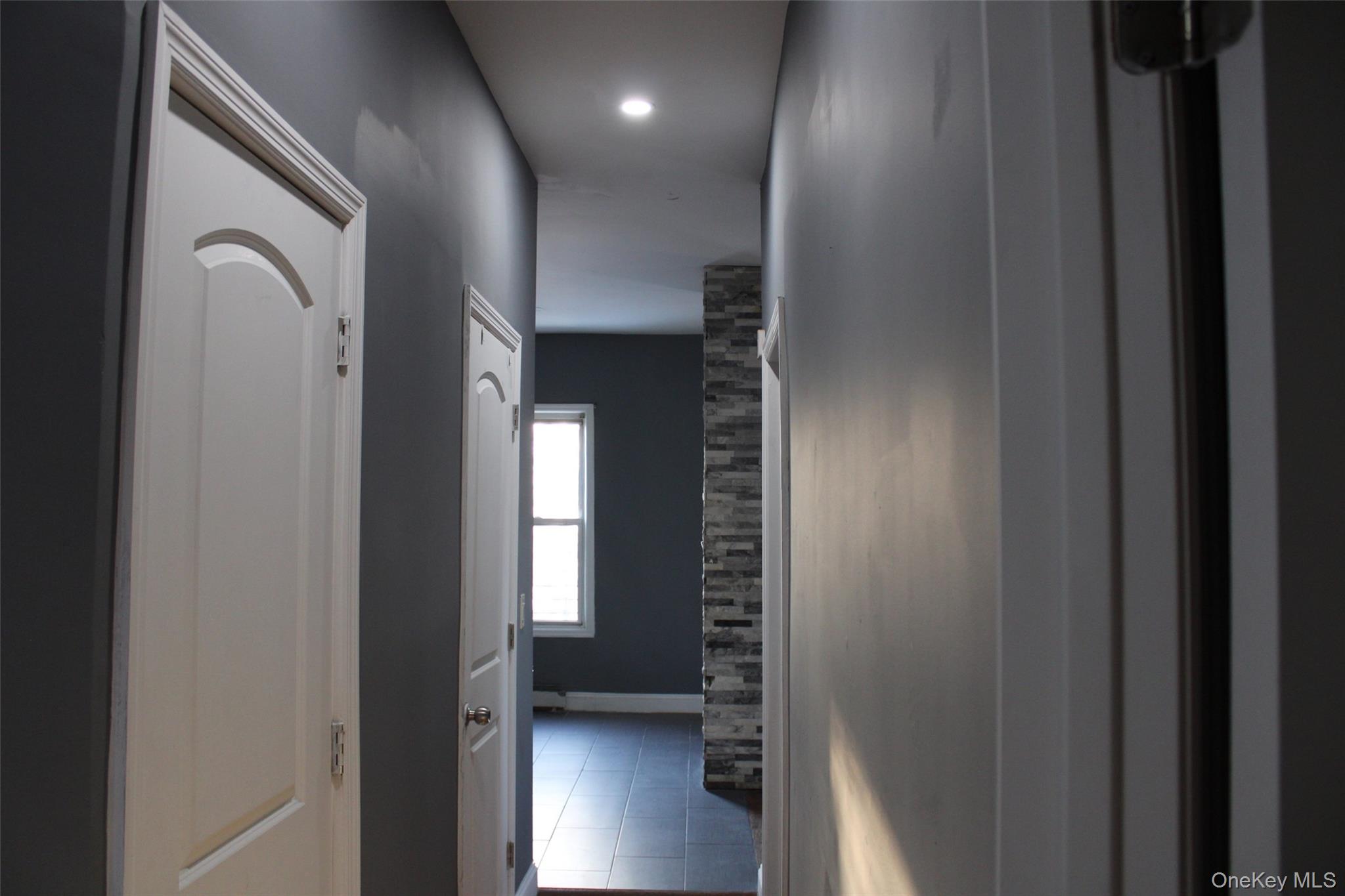1837 Victor Street Bronx, NY 10462 - Photo 4 of 10 a view of hallway with stairs and wooden floor