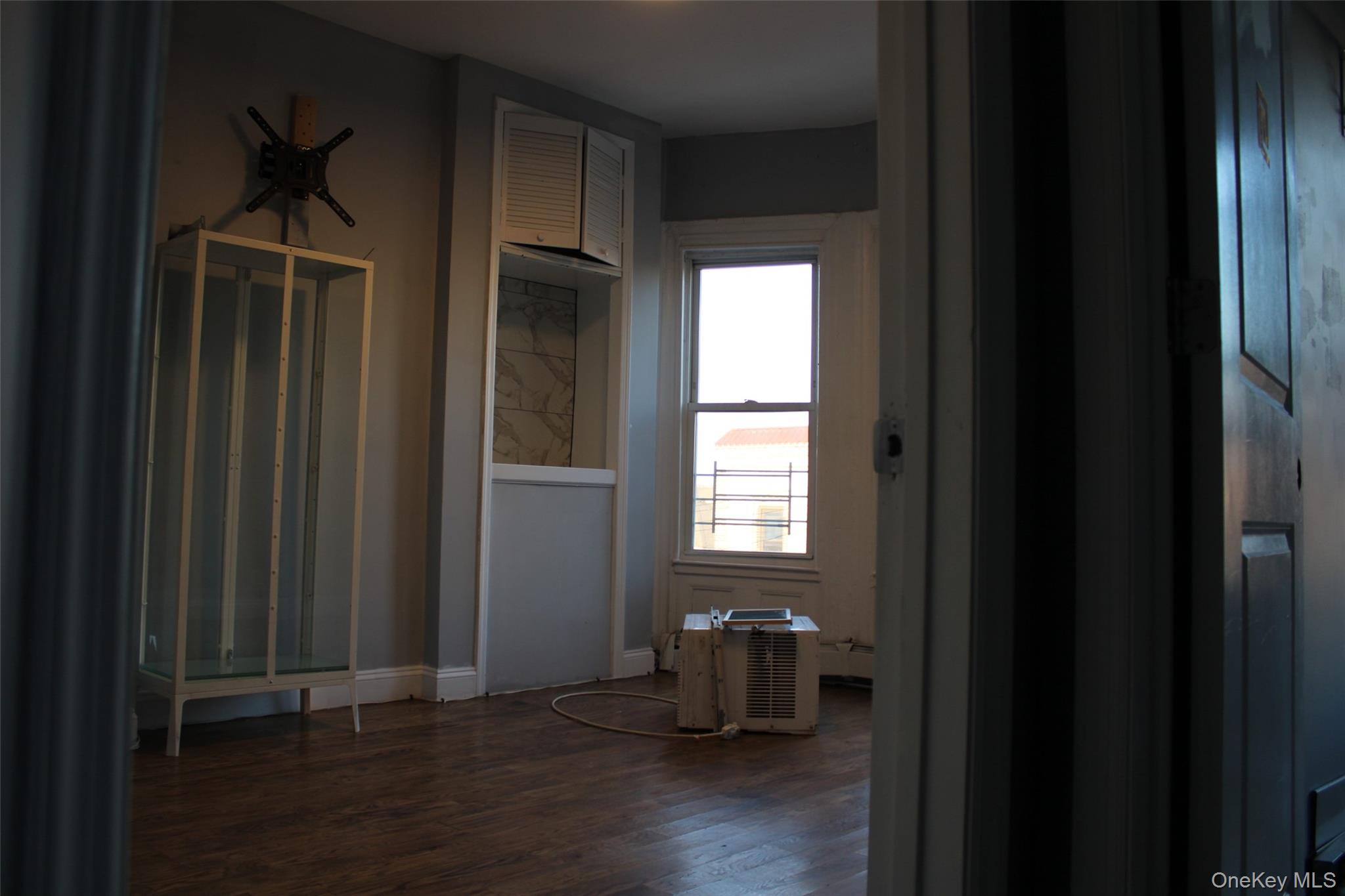 1837 Victor Street Bronx, NY 10462 - Photo 7 of 10 a view of empty room with wooden floor and fan
