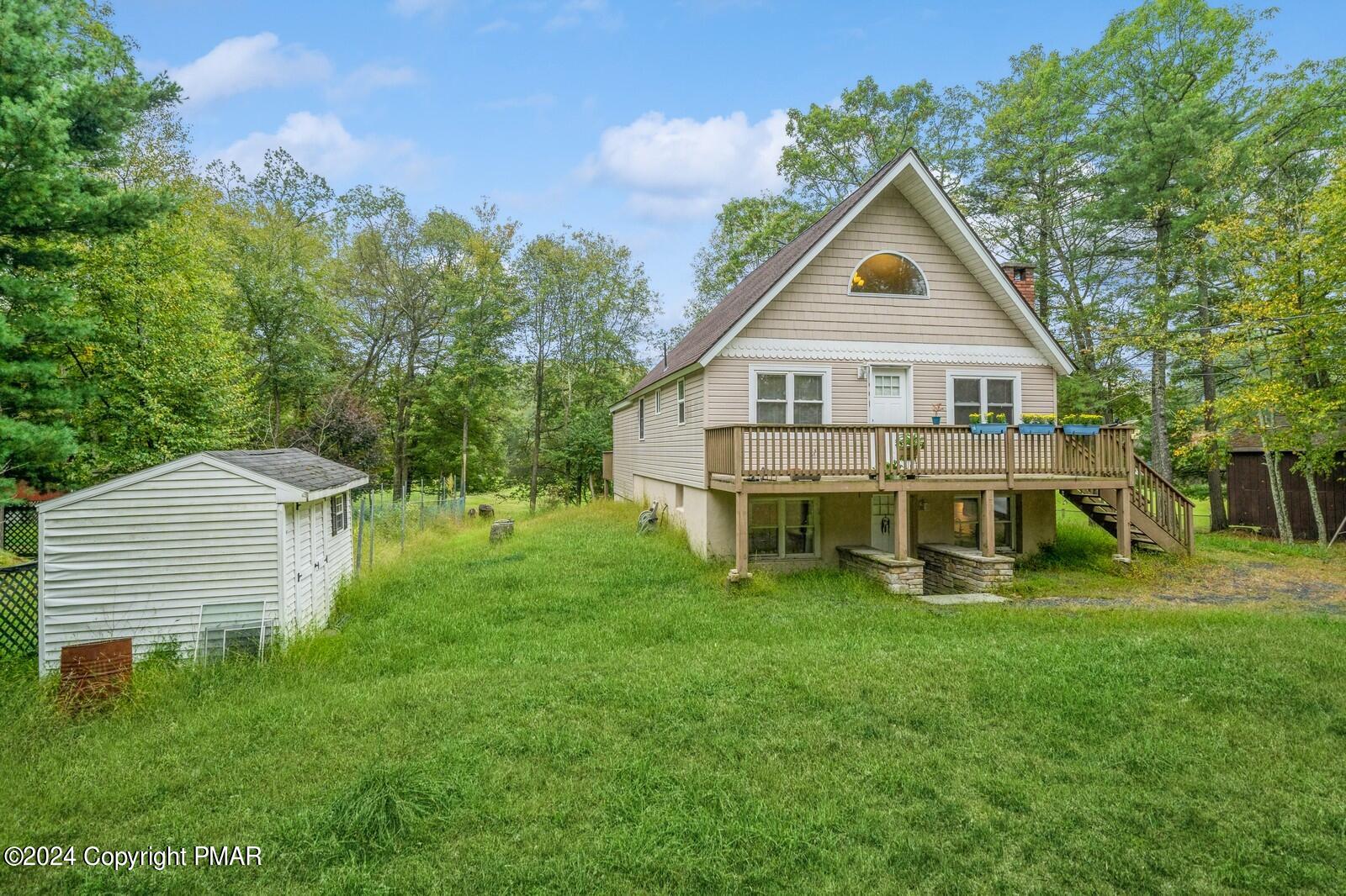 104 Swan Drive Dingmans Ferry, PA 18328 - Photo 2 of 36 a view of a house with a yard
