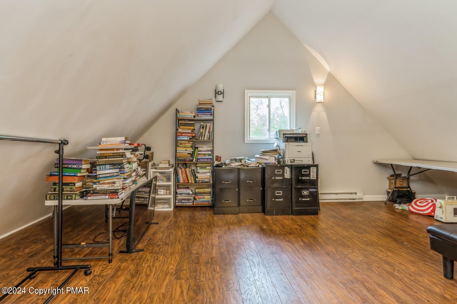 104 Swan Drive Dingmans Ferry, PA 18328 - Photo 25 of 36 a view of a workspace with furniture and wooden floor