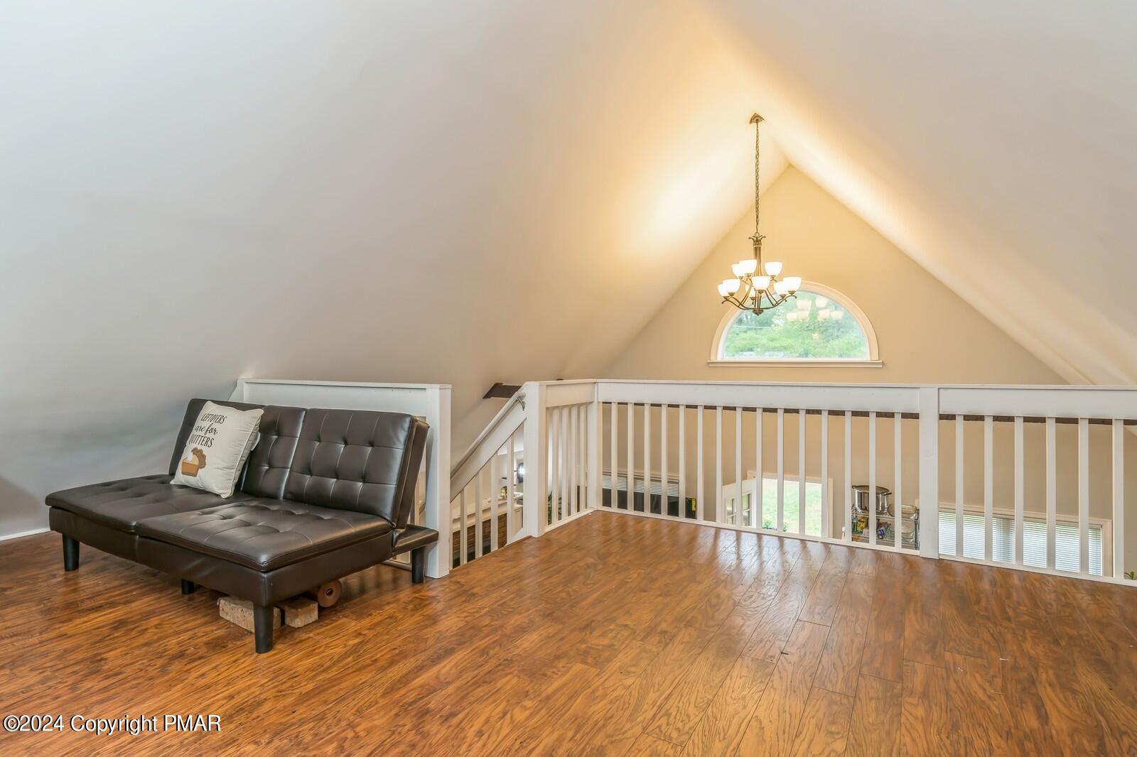 104 Swan Drive Dingmans Ferry, PA 18328 - Photo 26 of 36 a living room with furniture and a table