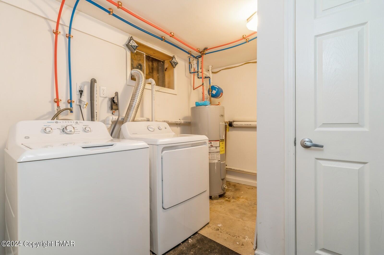 104 Swan Drive Dingmans Ferry, PA 18328 - Photo 27 of 36 a utility room with dryer and washer