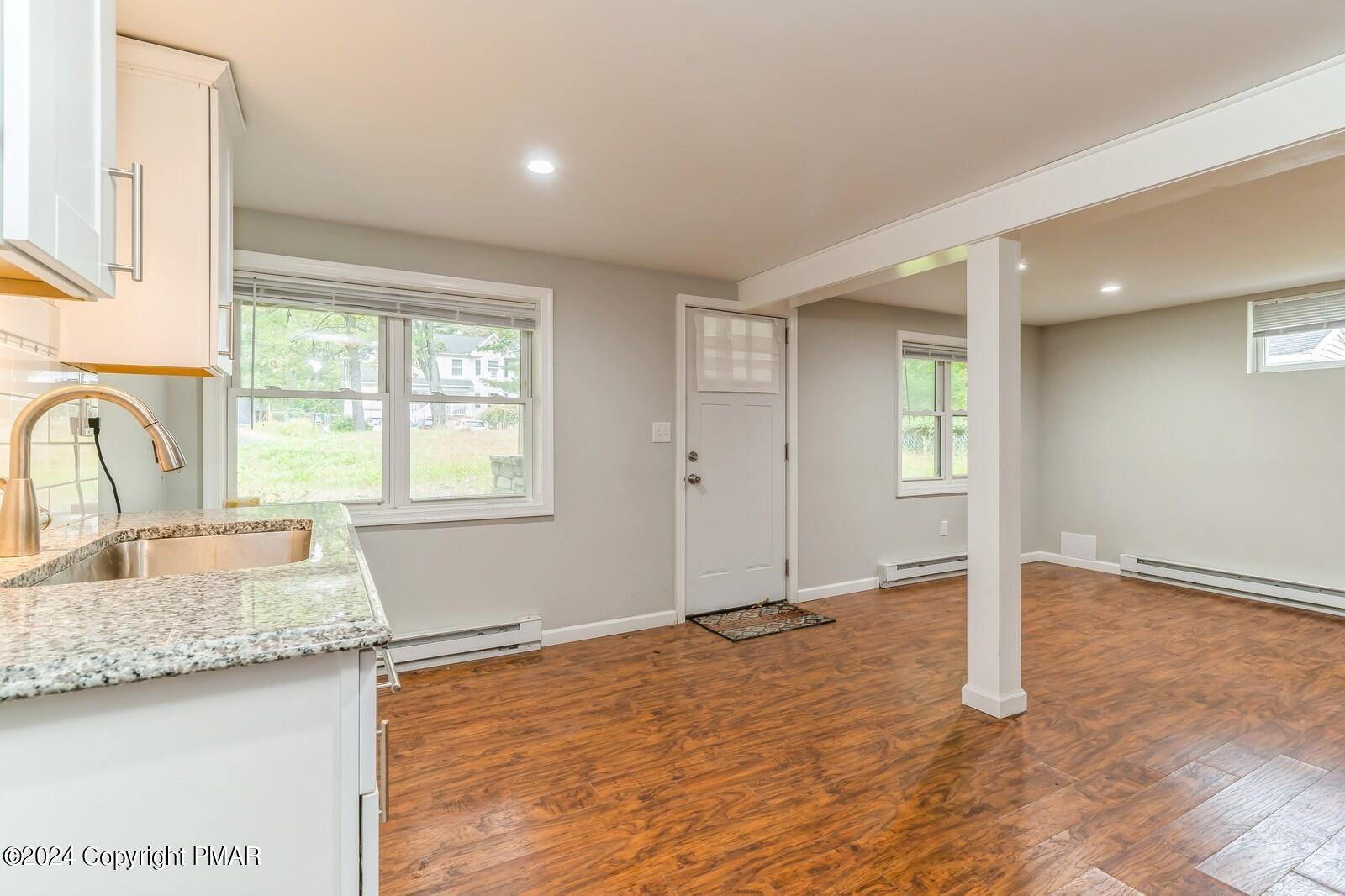 104 Swan Drive Dingmans Ferry, PA 18328 - Photo 29 of 36 a view of a kitchen island wooden floor and window