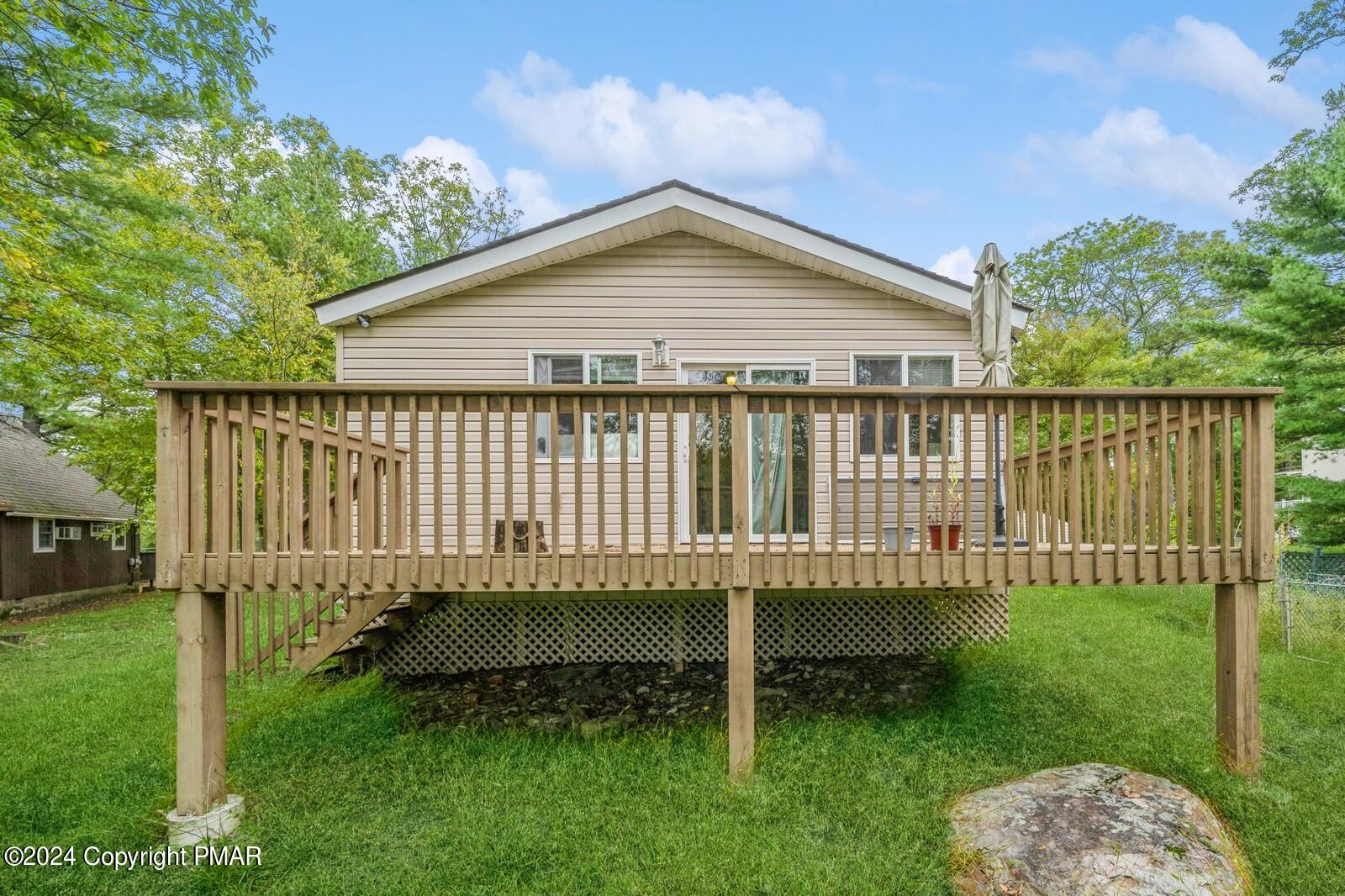 104 Swan Drive Dingmans Ferry, PA 18328 - Photo 35 of 36 a view of a backyard with a garden