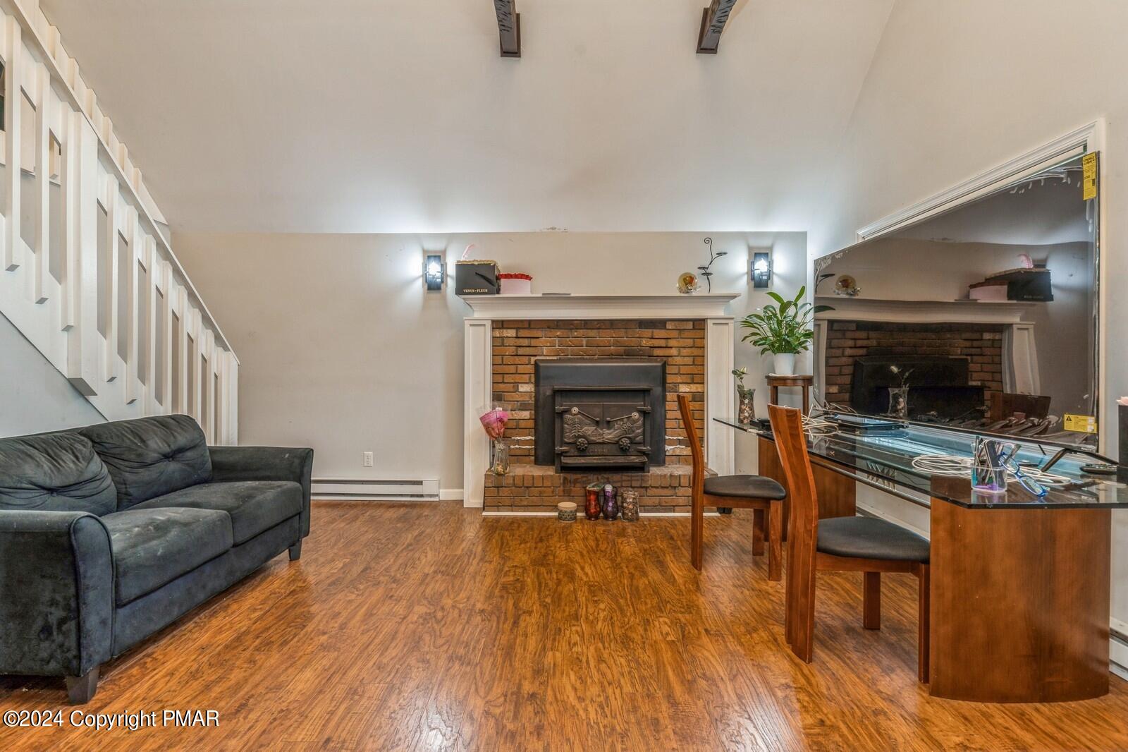 104 Swan Drive Dingmans Ferry, PA 18328 - Photo 6 of 36 a living room with furniture and a fireplace