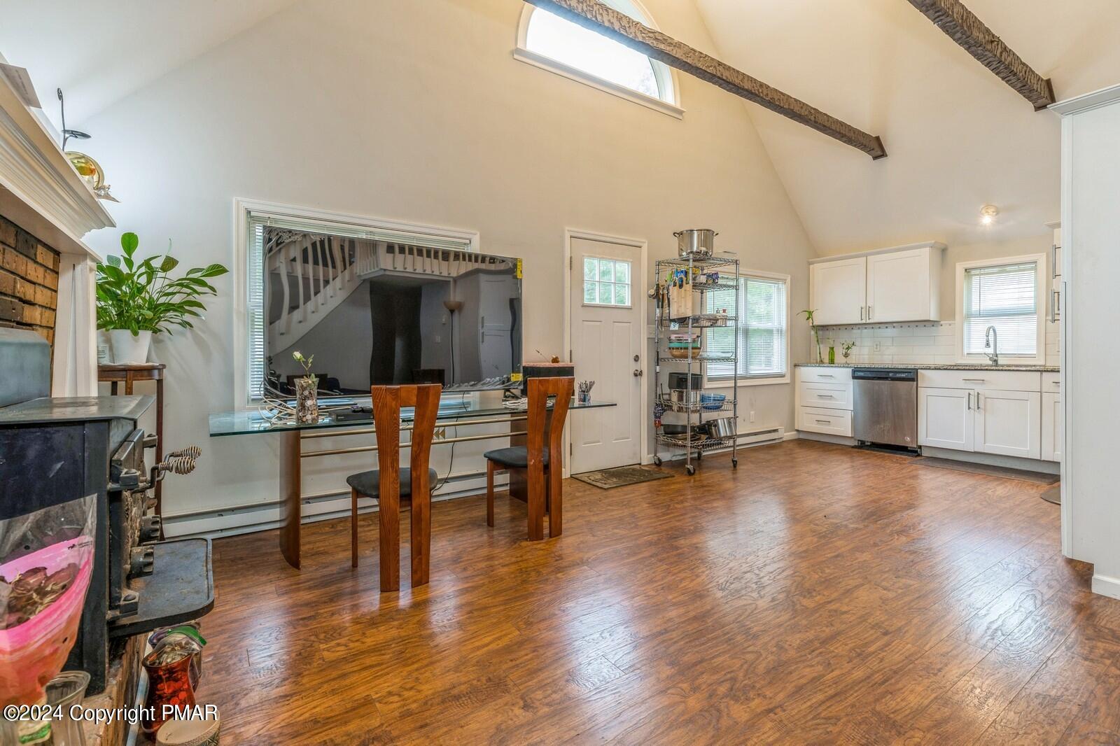 104 Swan Drive Dingmans Ferry, PA 18328 - Photo 8 of 36 a living room with furniture and a wooden floor