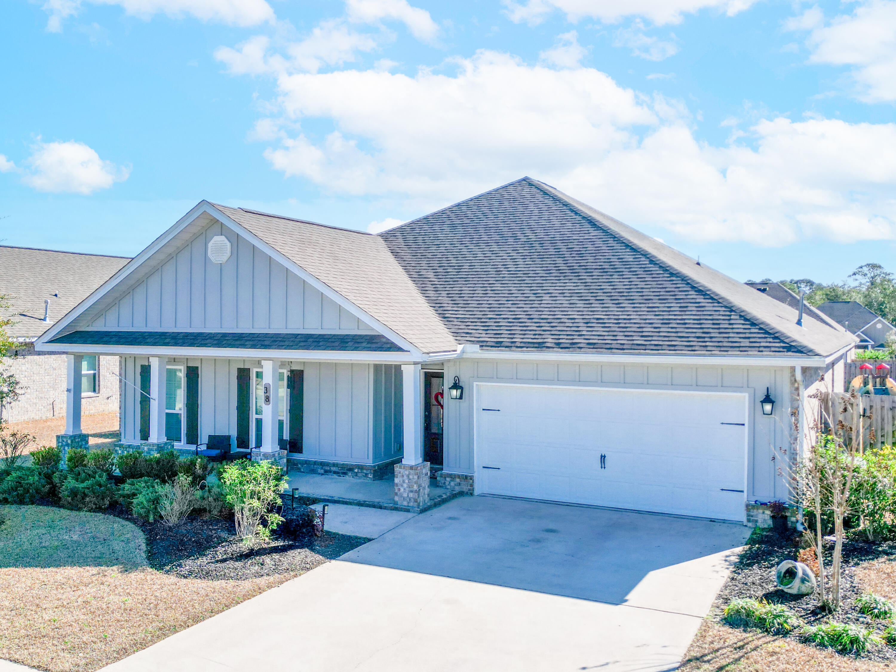a front view of a house with garden