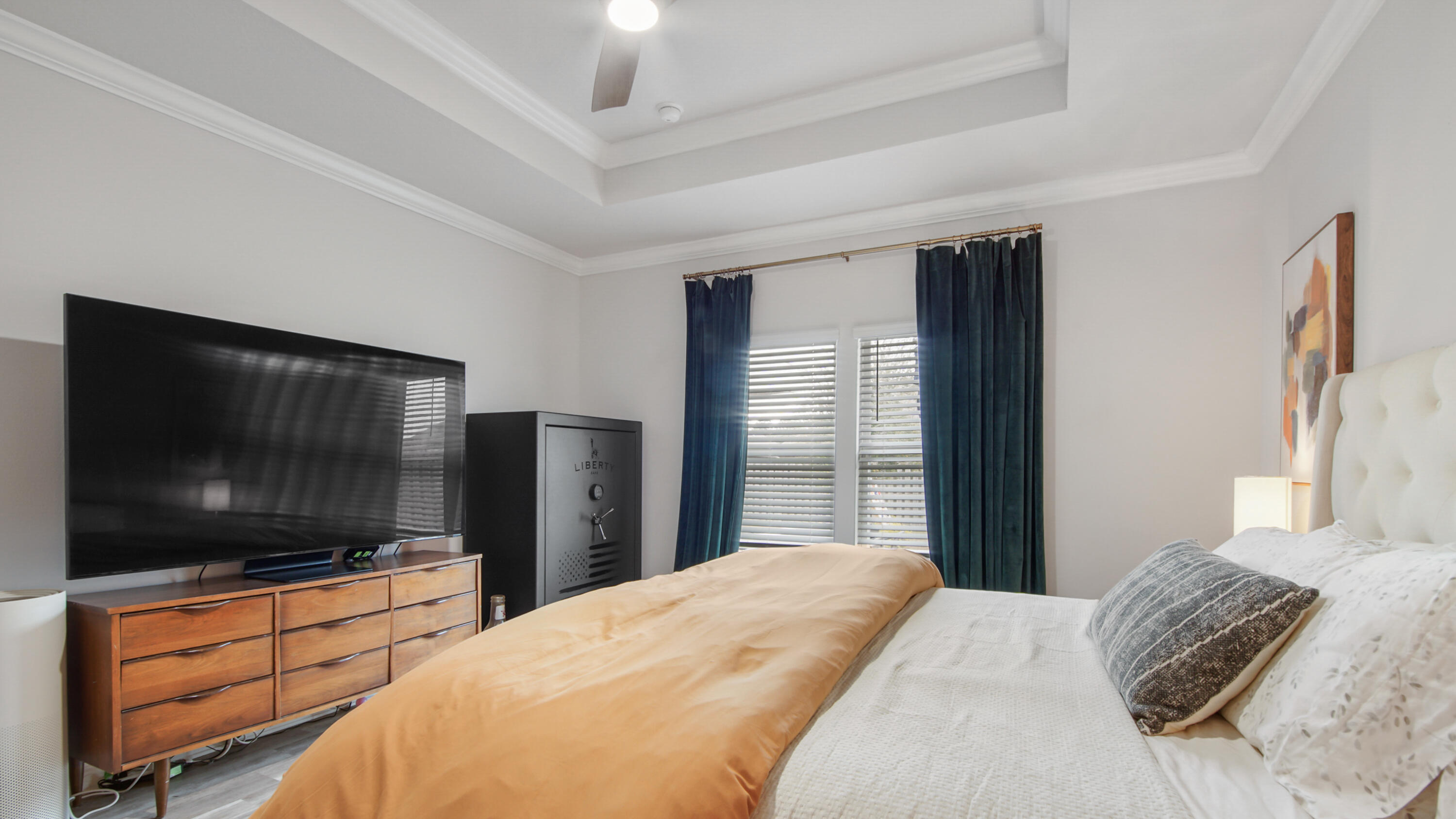 38 Norwich Road Freeport, FL 32439 - Photo 16 of 42 a bedroom with a large bed and a flat screen tv