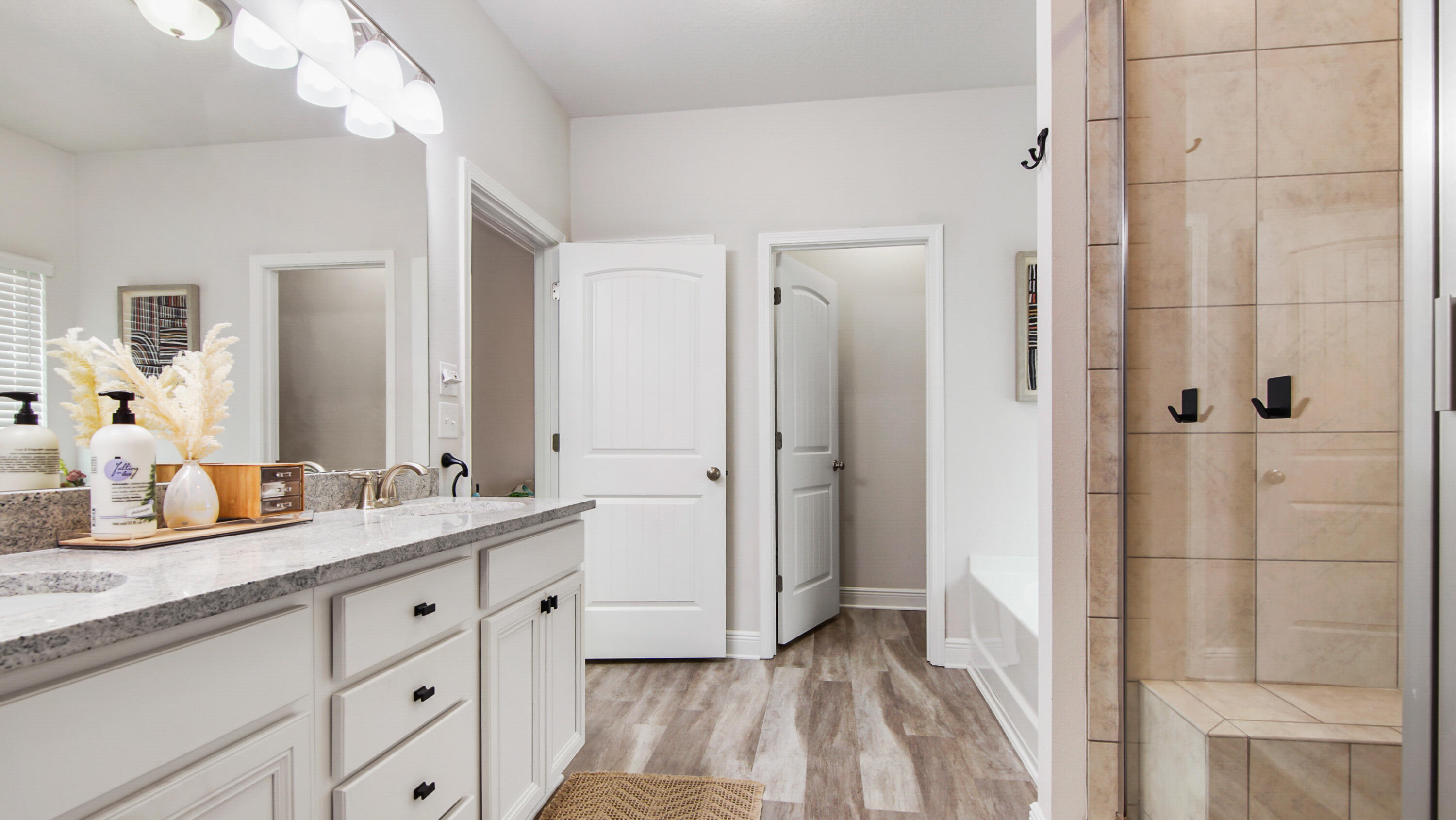 38 Norwich Road Freeport, FL 32439 - Photo 20 of 42 a spacious bathroom with a double vanity sink mirror and shower
