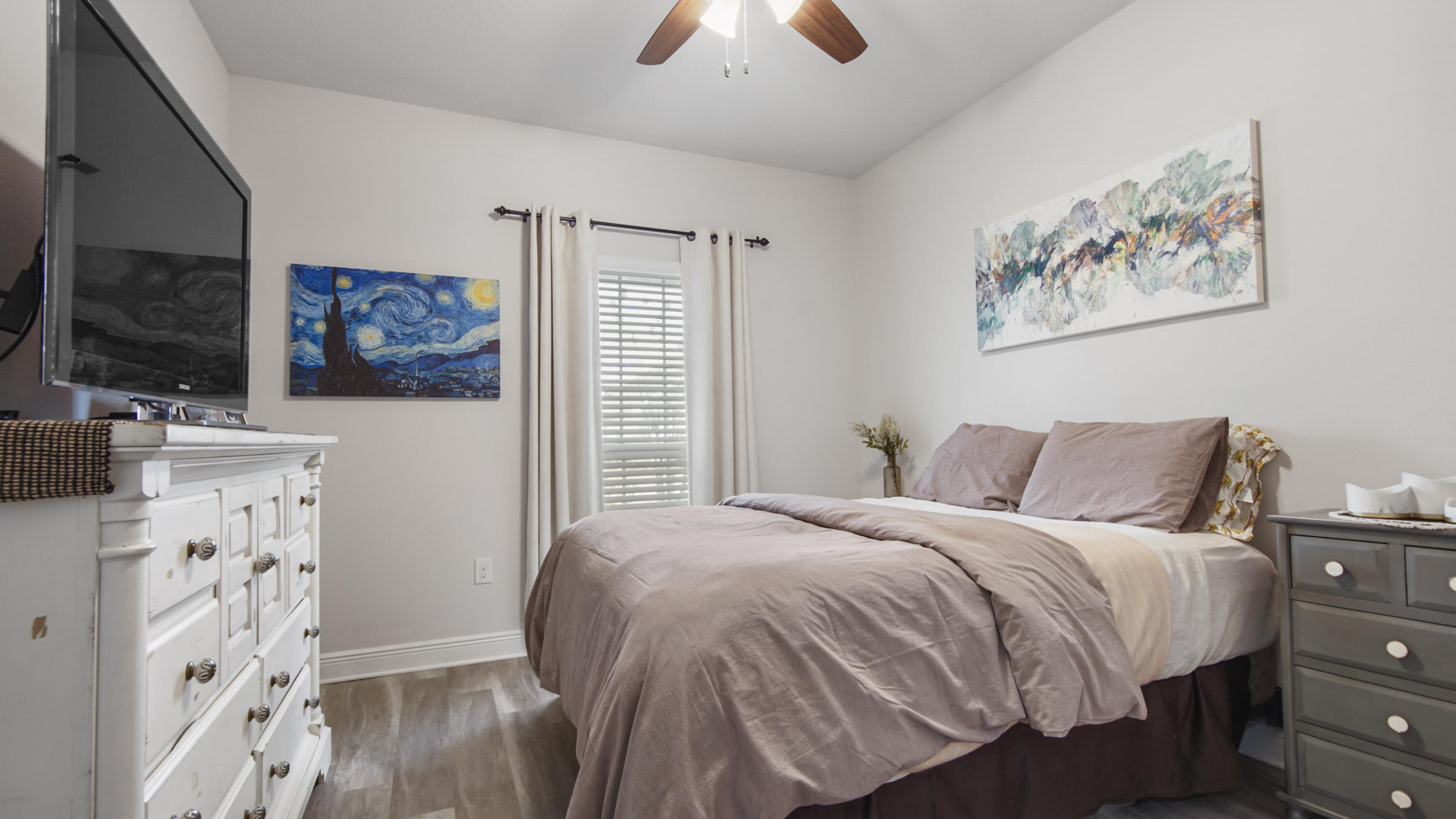 38 Norwich Road Freeport, FL 32439 - Photo 21 of 42 a bedroom with a bed and a flat screen tv