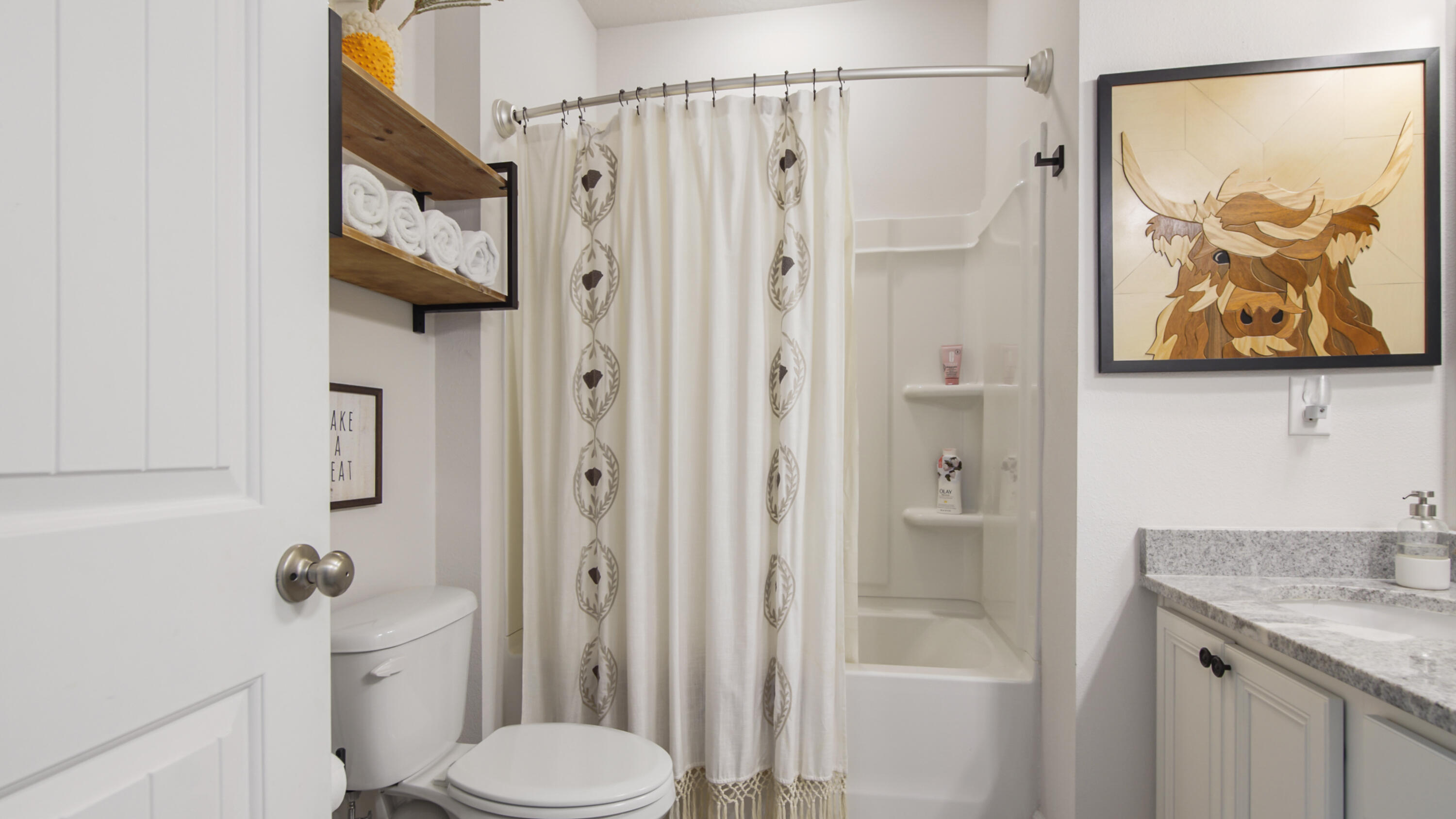 38 Norwich Road Freeport, FL 32439 - Photo 27 of 42 a bathroom with a granite countertop toilet sink and shower