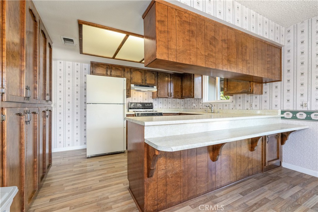 4530 San Ardo Avenue Atascadero, CA 93422 - Photo 11 of 37 a kitchen with stainless steel appliances granite countertop a stove a sink and a refrigerator