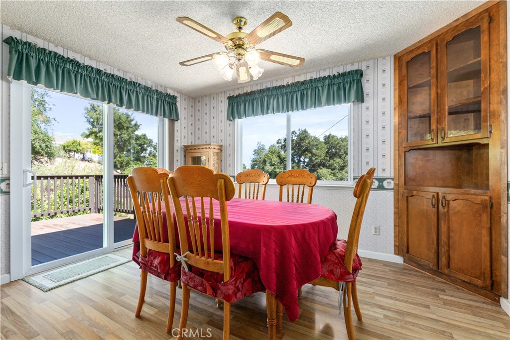 4530 San Ardo Avenue Atascadero, CA 93422 - Photo 14 of 37 a view of a dining room with furniture window and wooden floor