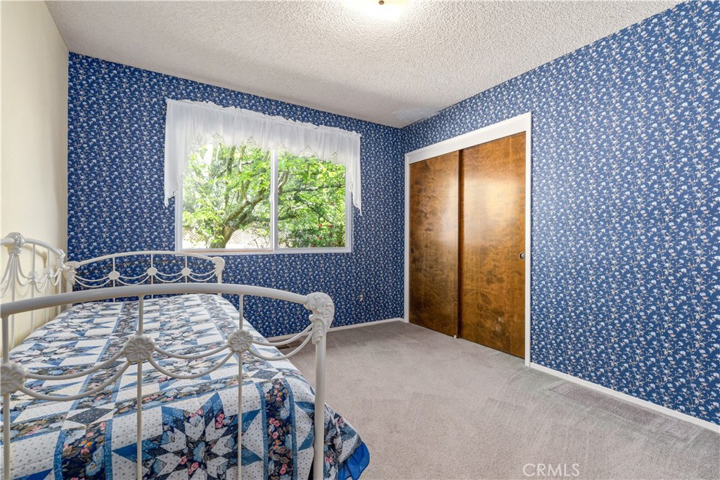4530 San Ardo Avenue Atascadero, CA 93422 - Photo 15 of 37 a bedroom with a bed and a window