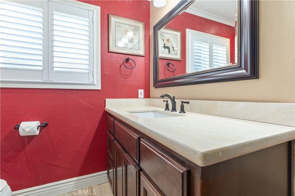 4530 San Ardo Avenue Atascadero, CA 93422 - Photo 18 of 37 a bathroom with a sink vanity and a mirror