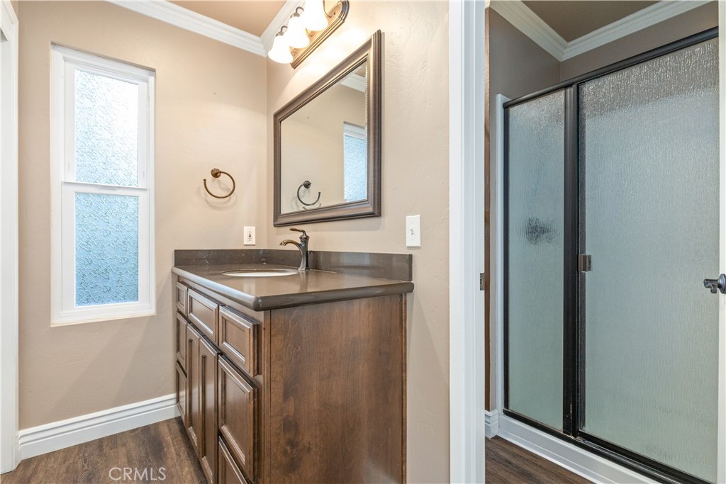 4530 San Ardo Avenue Atascadero, CA 93422 - Photo 22 of 37 a bathroom with a sink a mirror and a vanity