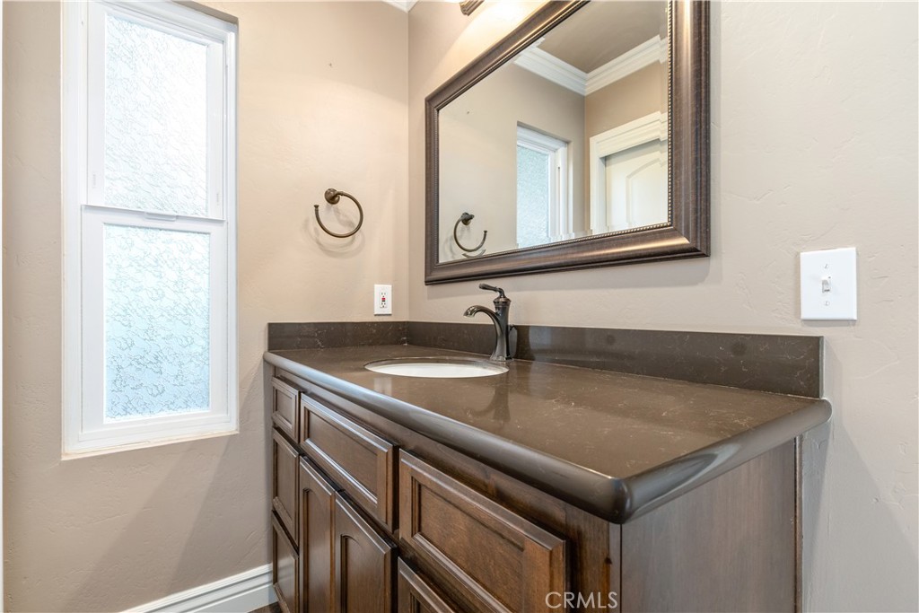 4530 San Ardo Avenue Atascadero, CA 93422 - Photo 23 of 37 a bathroom with a sink and a mirror