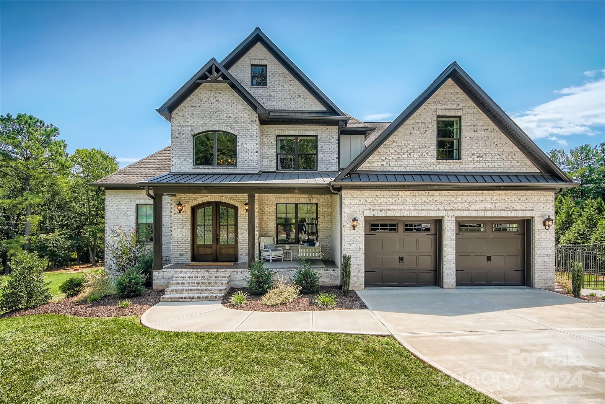 2926 Dodsworth Drive Cramerton, NC 28032 - Photo 1 of 33 a front view of a house with a yard and garage