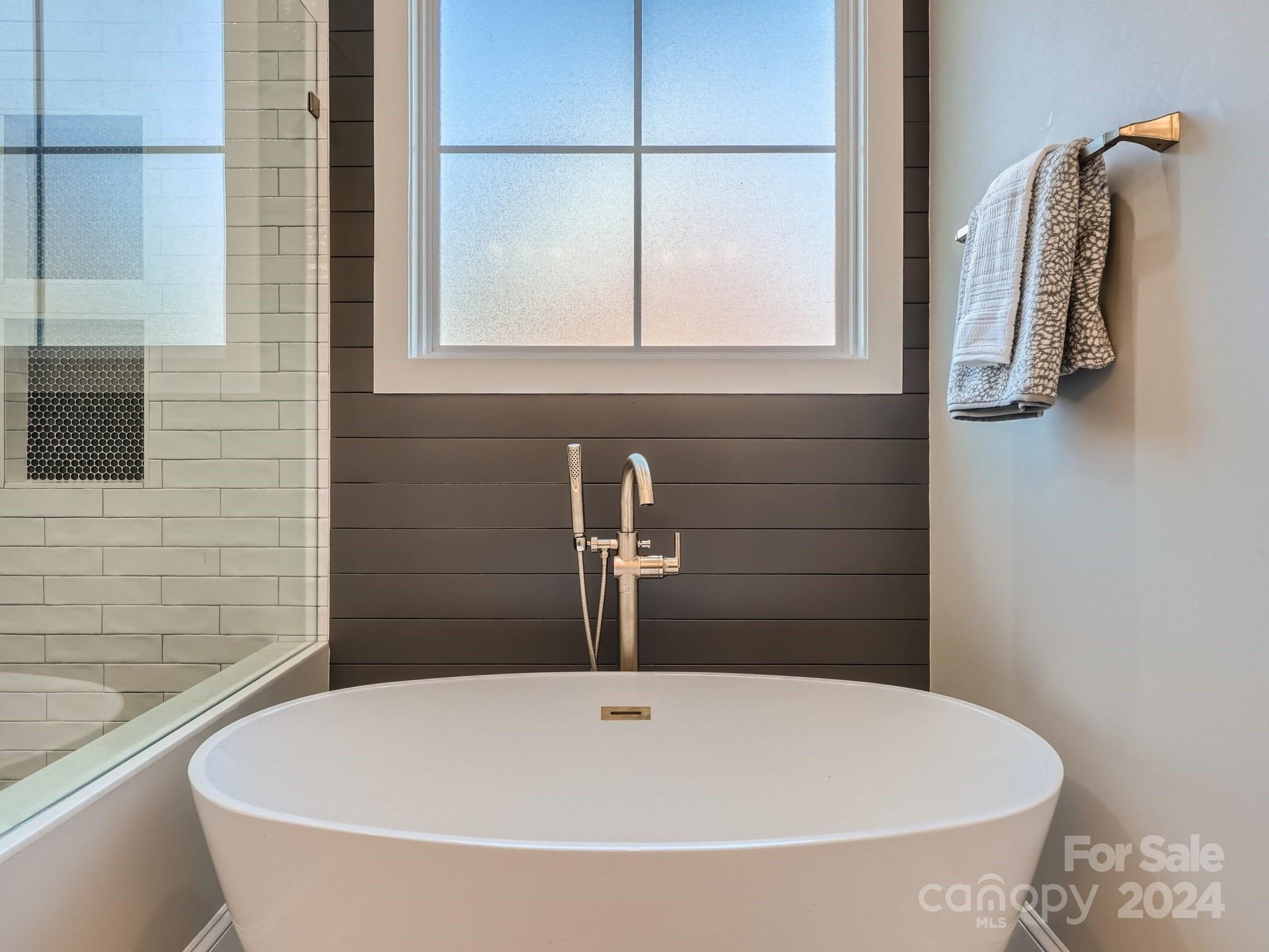 2926 Dodsworth Drive Cramerton, NC 28032 - Photo 16 of 33 a bathroom with a tub and a shower