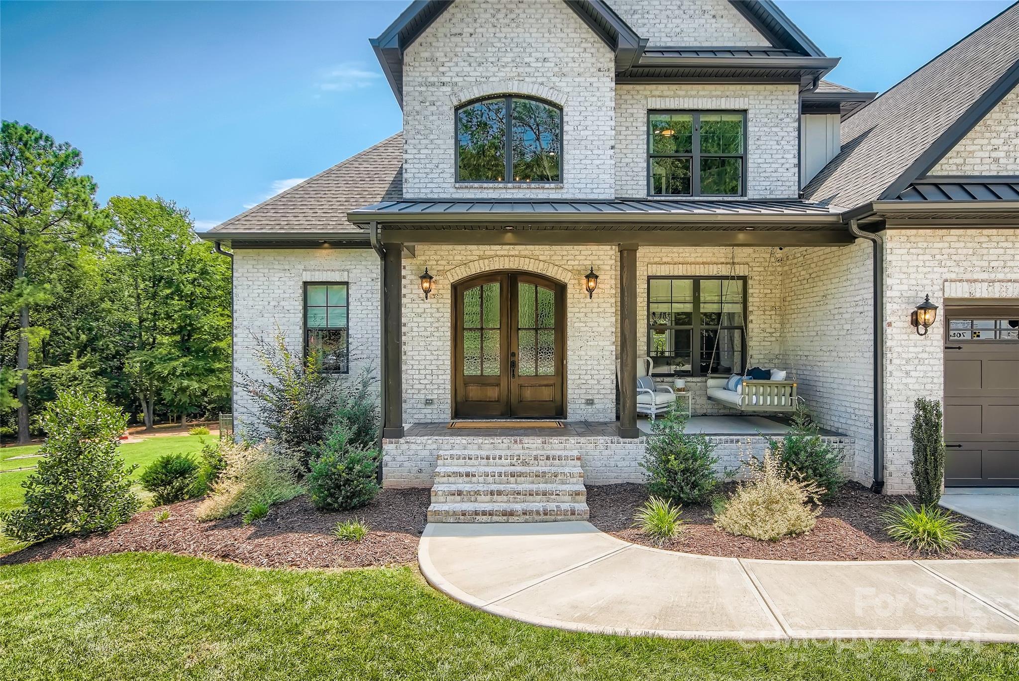 2926 Dodsworth Drive Cramerton, NC 28032 - Photo 2 of 33 a front view of a house with garden