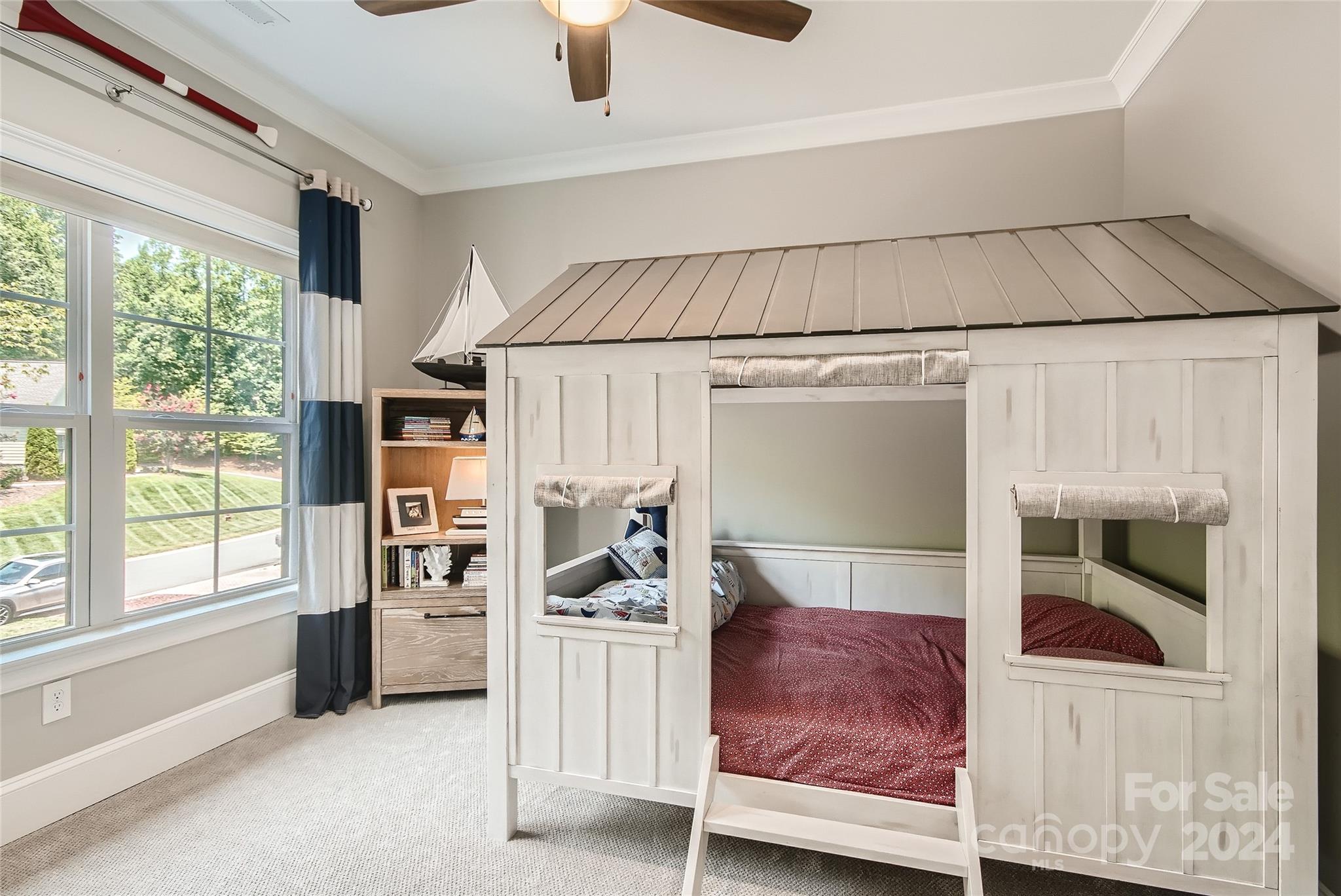 2926 Dodsworth Drive Cramerton, NC 28032 - Photo 23 of 33 a living room with furniture and a floor to ceiling window