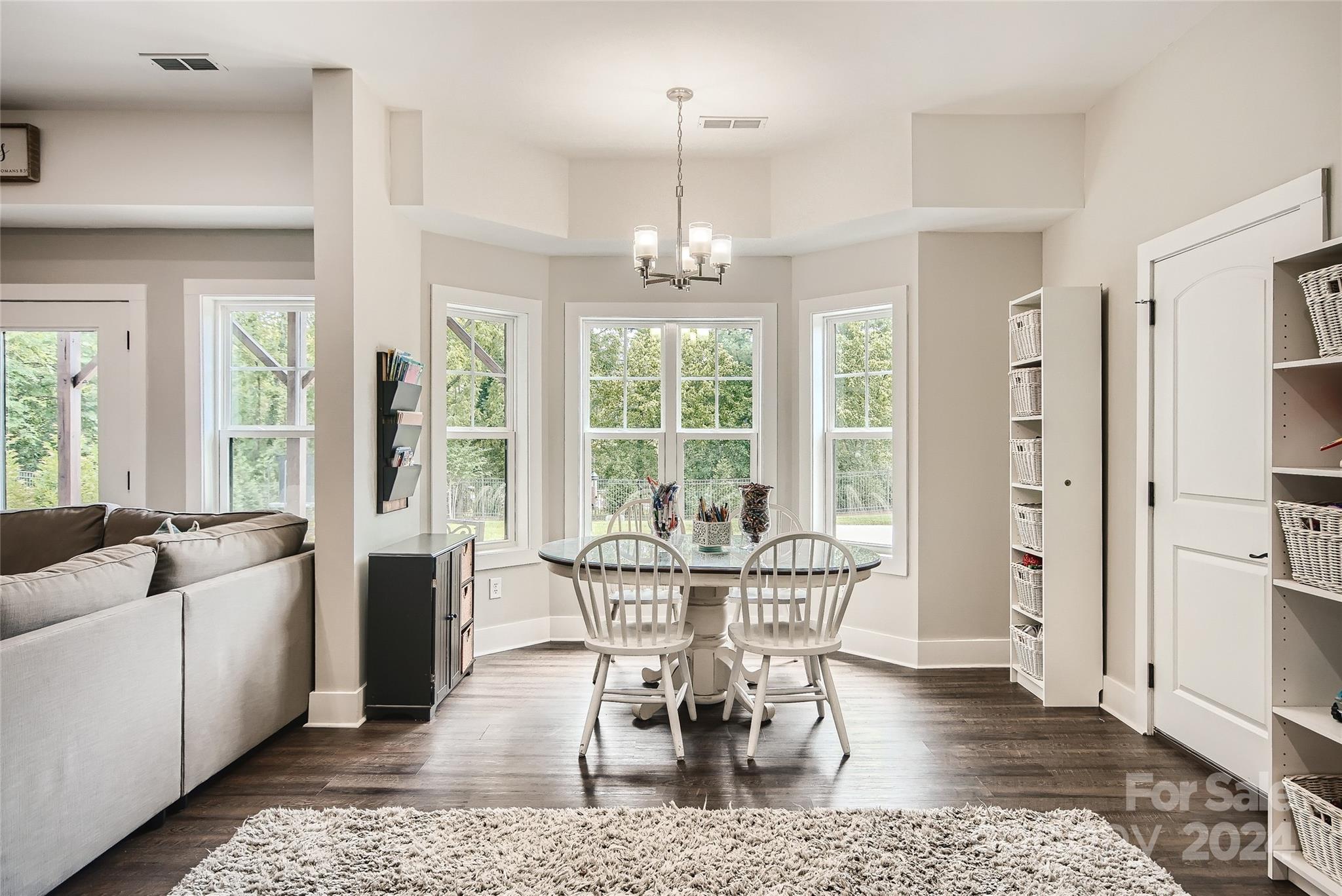 2926 Dodsworth Drive Cramerton, NC 28032 - Photo 26 of 33 a view of a dining room with furniture window and wooden floor
