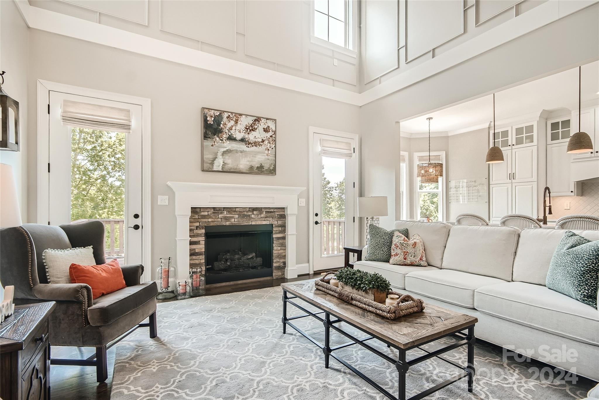 2926 Dodsworth Drive Cramerton, NC 28032 - Photo 5 of 33 a living room with furniture a fireplace and a large window