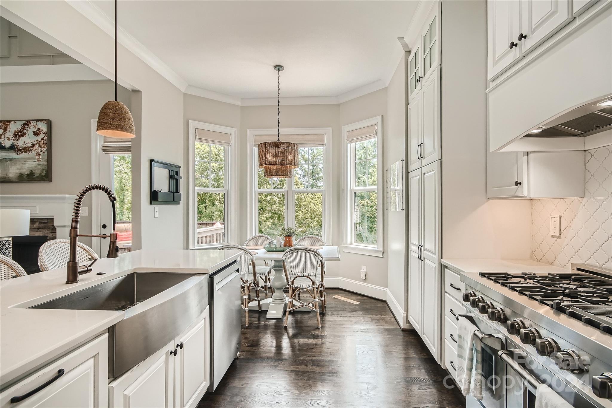 2926 Dodsworth Drive Cramerton, NC 28032 - Photo 8 of 33 a kitchen with stove a sink and cabinets