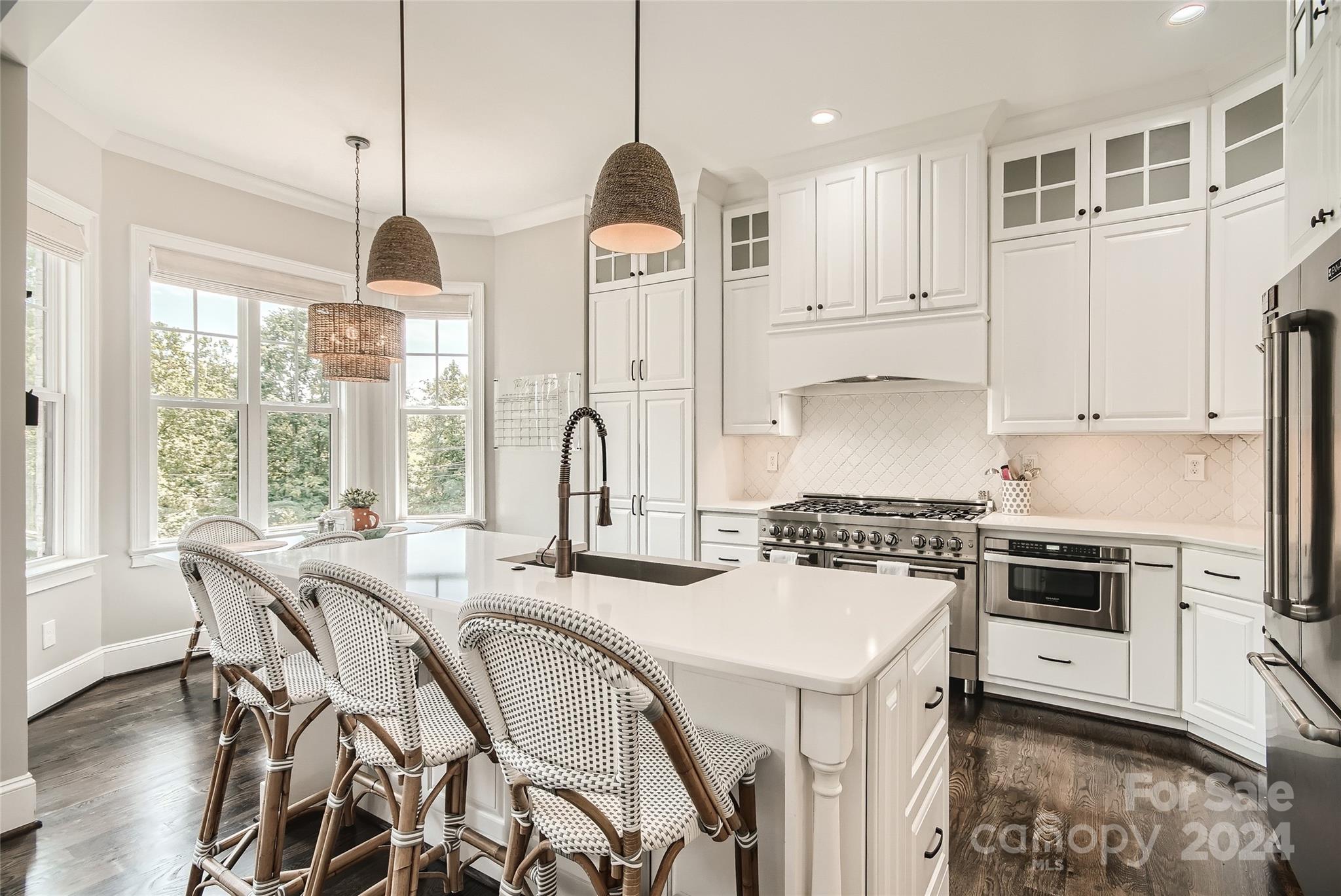 2926 Dodsworth Drive Cramerton, NC 28032 - Photo 10 of 33 a kitchen with stainless steel appliances a stove a sink a center island and a cabinets