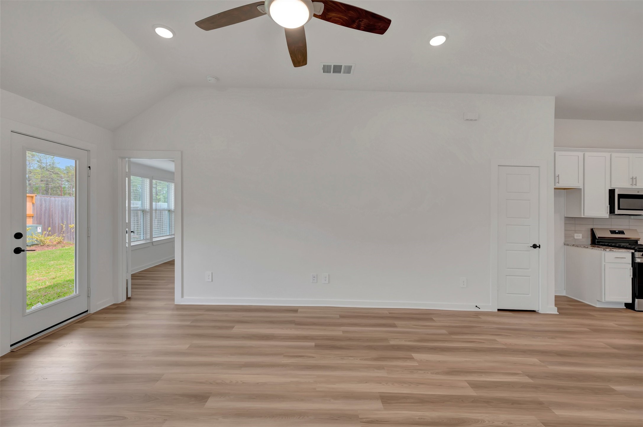 759 Hackberry Branch Magnolia, TX 77354 - Photo 25 of 43 an empty room with wooden floor and windows