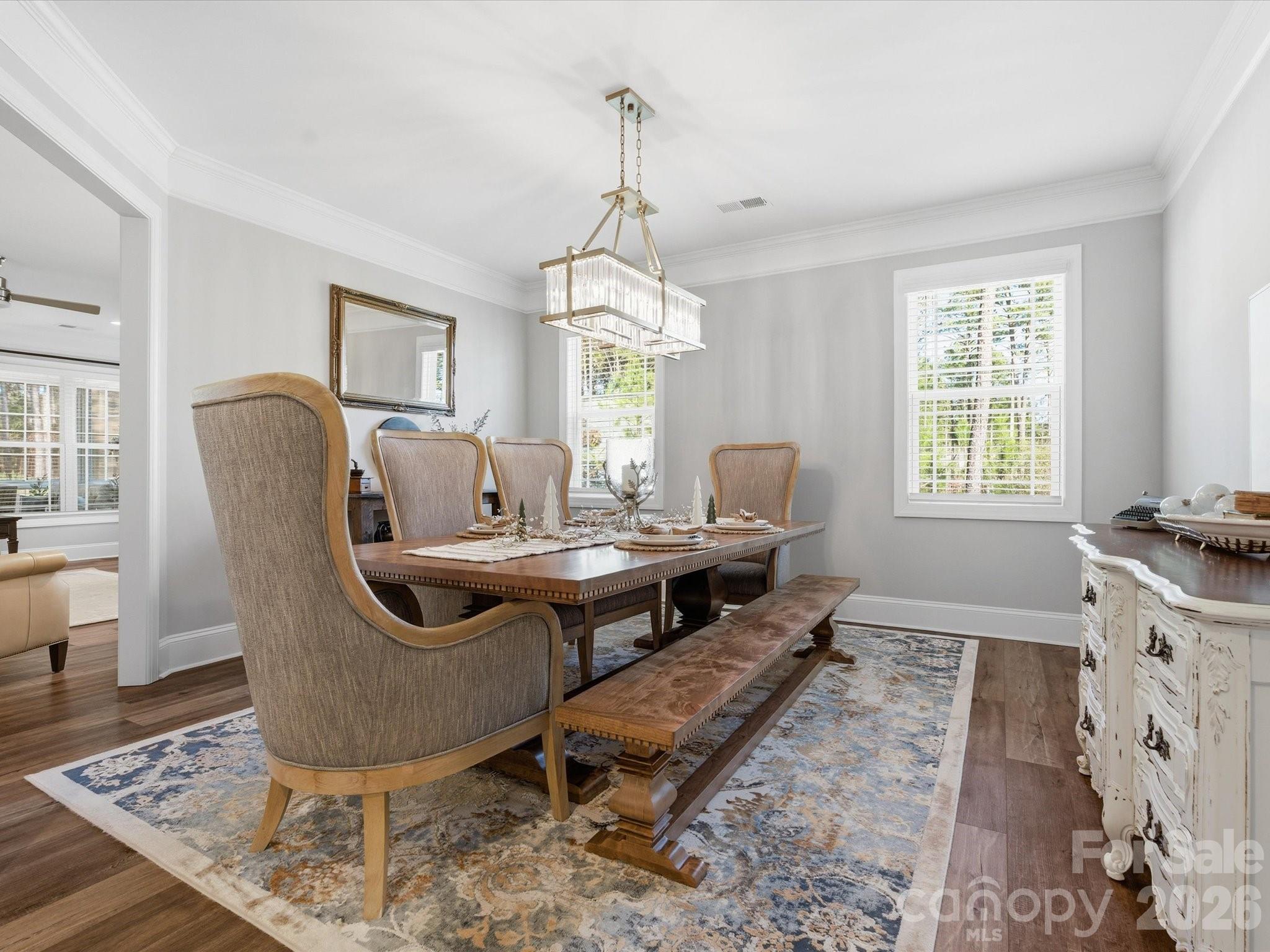 4166 Persimmon Road Lancaster, SC 29720 - Photo 5 of 41 a dining room with furniture a chandelier and wooden floor