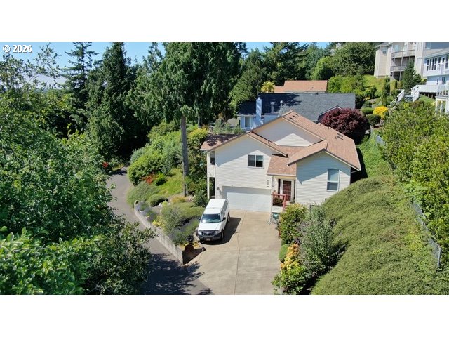 3520 Ocean View Drive Florence, OR 97439 - Photo 1 of 44 a aerial view of a house with yard and outdoor seating
