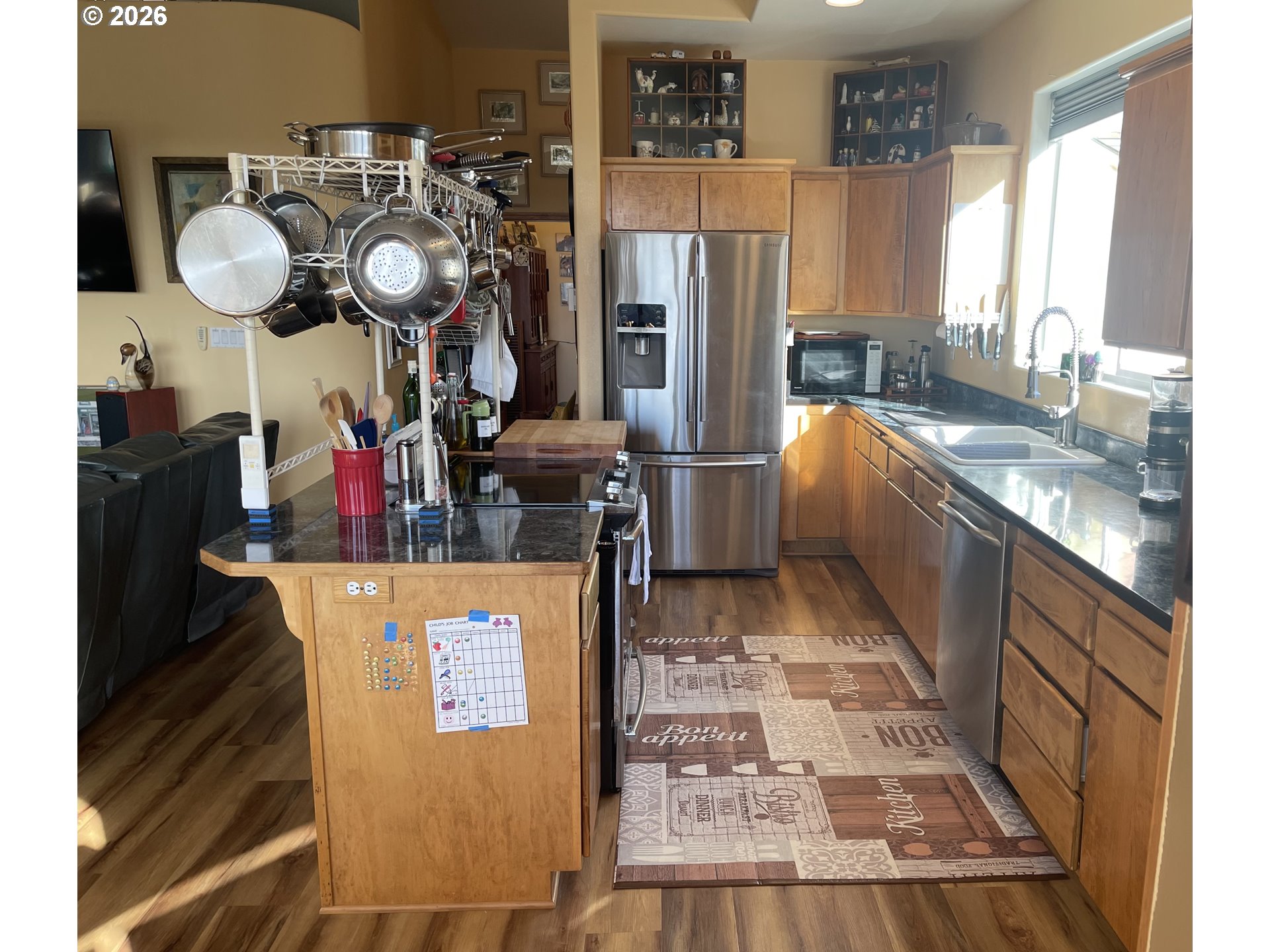3520 Ocean View Drive Florence, OR 97439 - Photo 13 of 44 a kitchen with granite countertop a refrigerator a stove top oven a sink and dishwasher