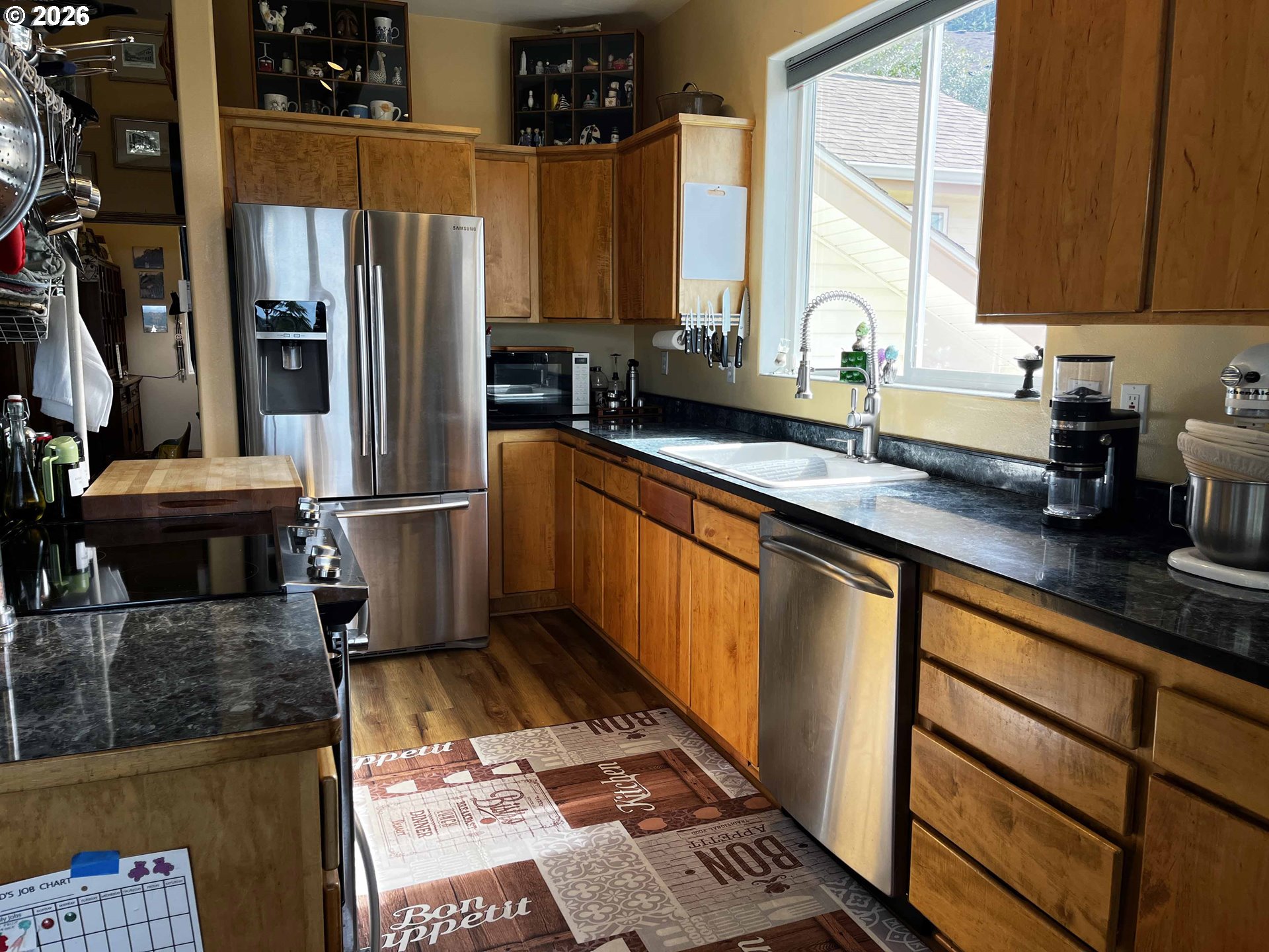 3520 Ocean View Drive Florence, OR 97439 - Photo 14 of 44 a kitchen with stainless steel appliances granite countertop a refrigerator and a sink