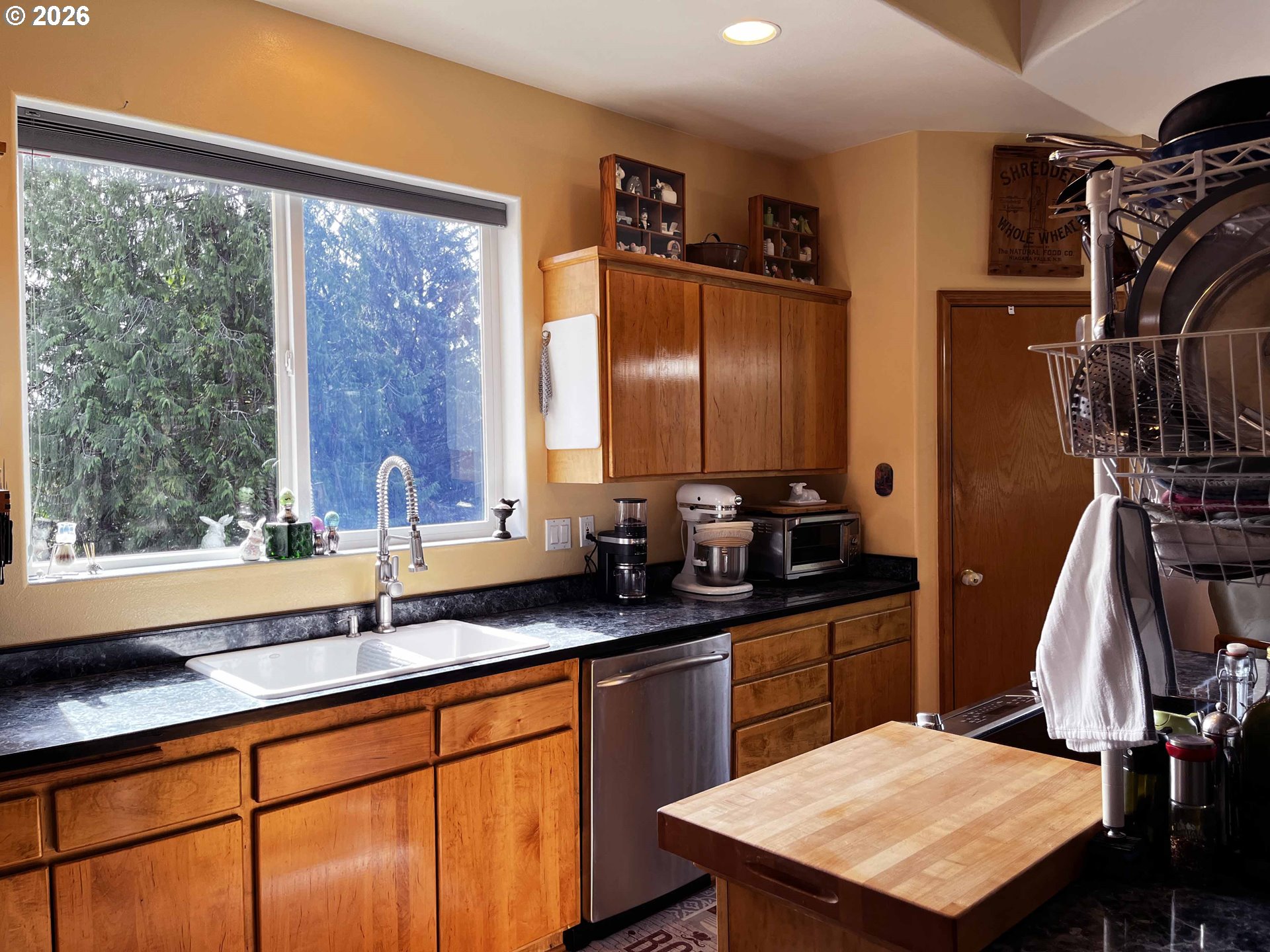 3520 Ocean View Drive Florence, OR 97439 - Photo 15 of 44 a kitchen with a sink a counter top space and stainless steel appliances