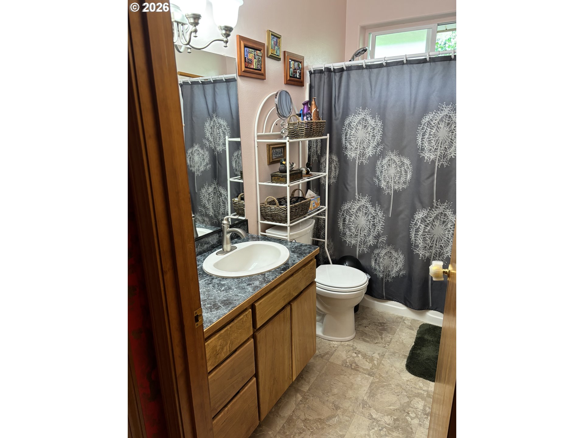 3520 Ocean View Drive Florence, OR 97439 - Photo 28 of 44 a bathroom with a granite countertop toilet sink and mirror