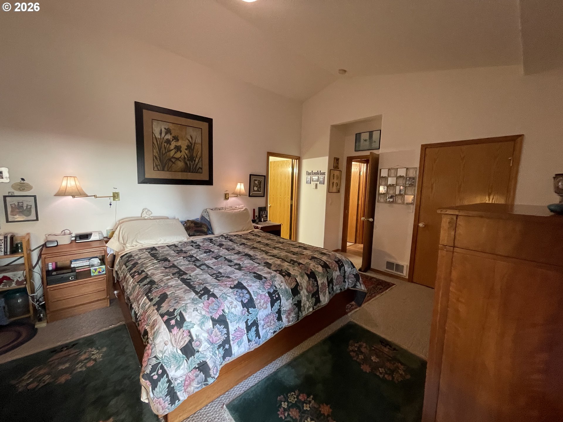 3520 Ocean View Drive Florence, OR 97439 - Photo 31 of 44 a bedroom with bed and wooden floor