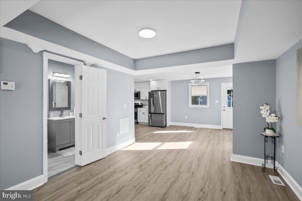 57 Transverse Avenue Middle River, MD 21220 - Photo 11 of 35 a view of livingroom with hardwood floor and hallway