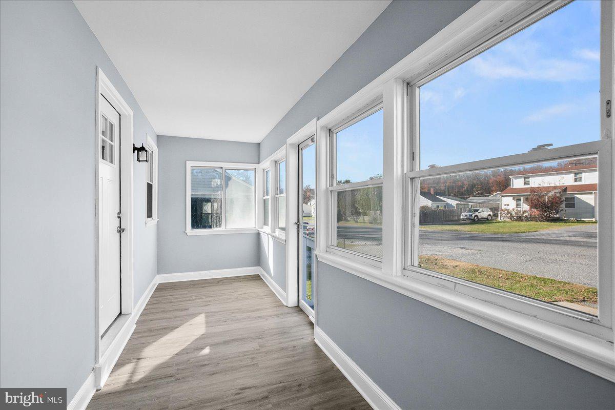 57 Transverse Avenue Middle River, MD 21220 - Photo 3 of 35 a view of an entryway with wooden floor and windows