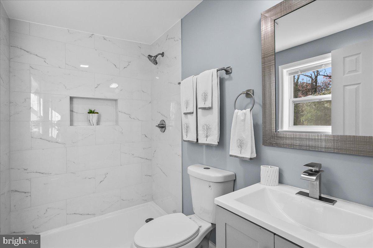 57 Transverse Avenue Middle River, MD 21220 - Photo 31 of 35 a bathroom with a sink toilet and shower