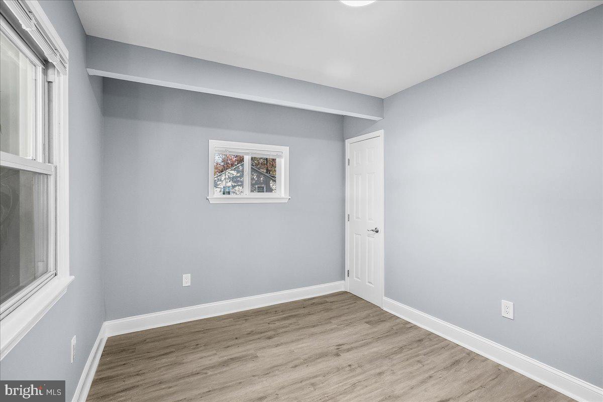 57 Transverse Avenue Middle River, MD 21220 - Photo 7 of 35 a view of room with window and wooden floor
